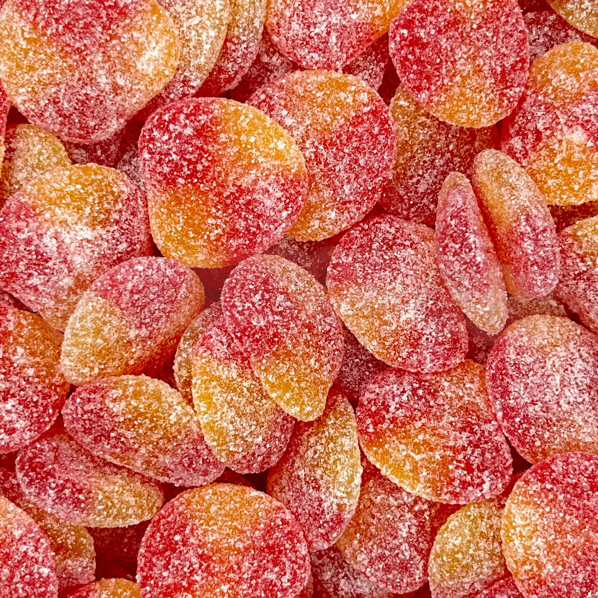 Gros plan sur des bonbons pêche gélifiés acidulés Haribo