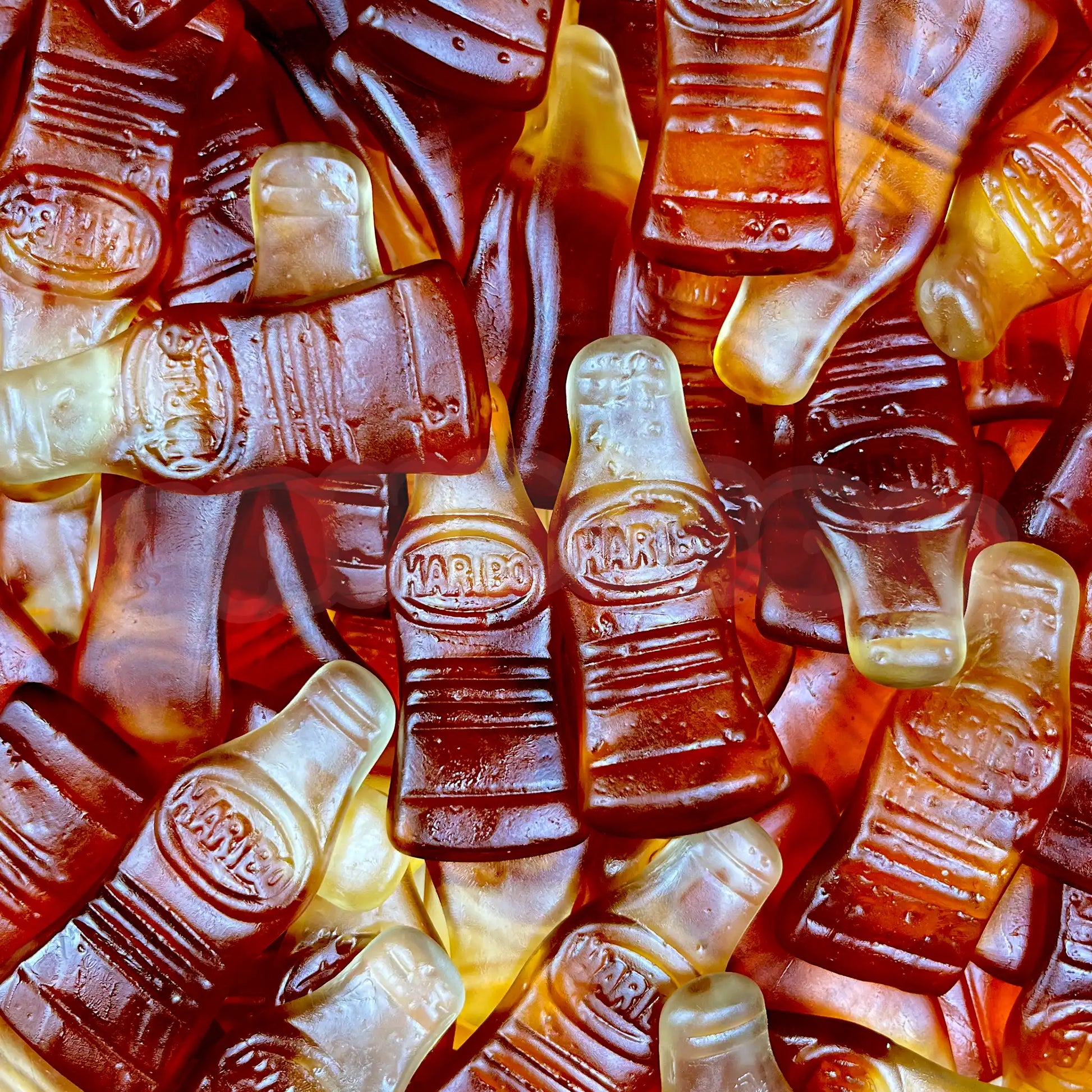Vue rapprochée de bouteilles cola gélifiées Haribo